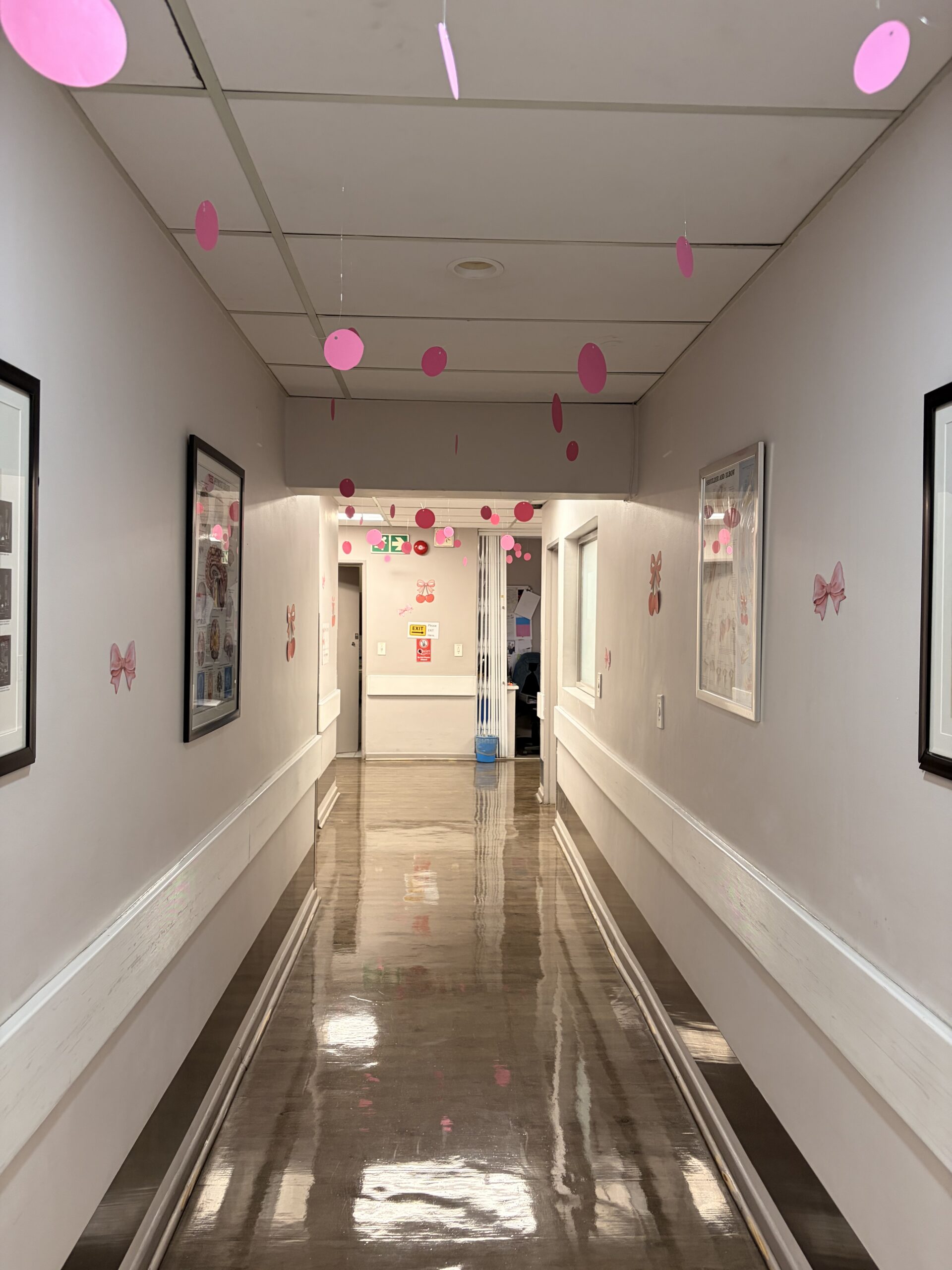 ImagePro Radiology corridor decorated with hanging pink circles and pink wall accents for October awareness